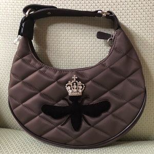 Chocolate brown quilted My Flat in London purse.